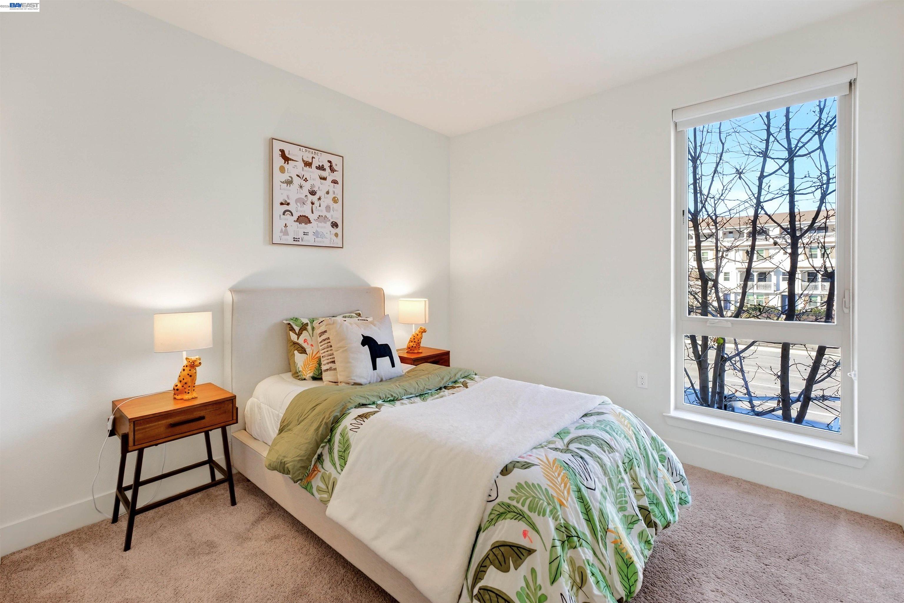 430 Montague Expressway, Unit 20 Milpitas, CA 95035 - Photo 15 of 50 a bedroom with a bed and a window