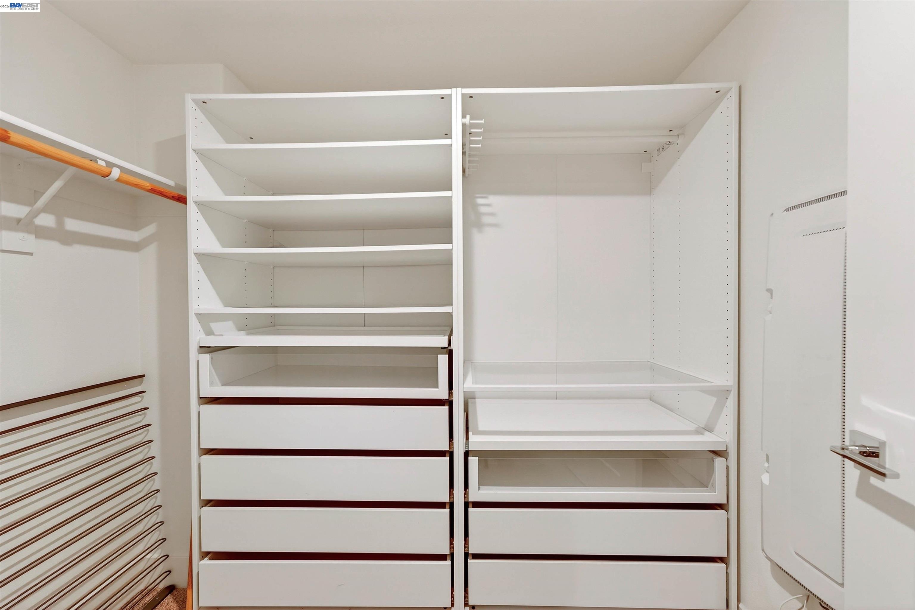 430 Montague Expressway, Unit 20 Milpitas, CA 95035 - Photo 20 of 50 a view of walk in closet with empty racks