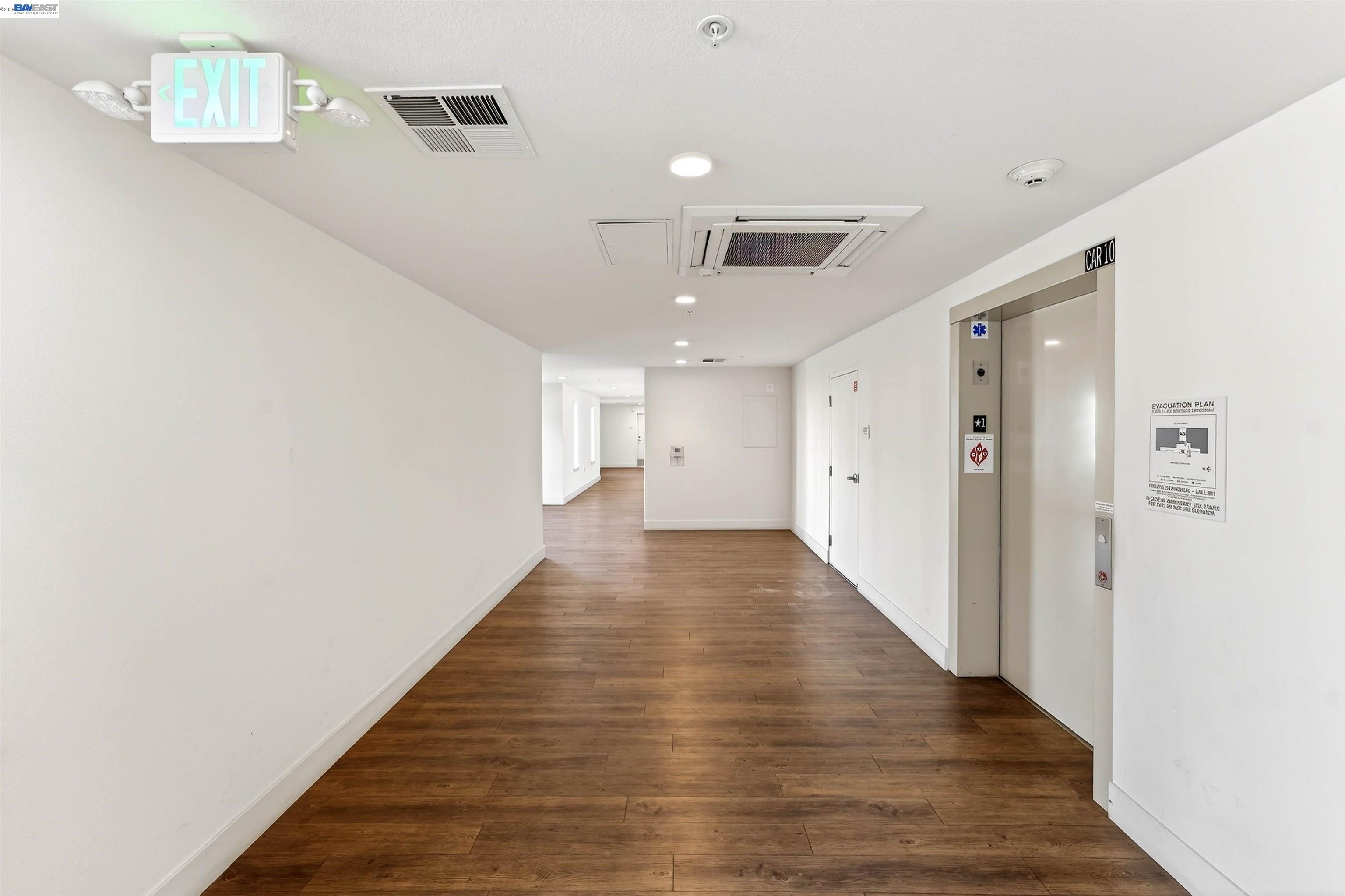 430 Montague Expressway, Unit 20 Milpitas, CA 95035 - Photo 26 of 50 a view of a hallway with wooden floor and staircase