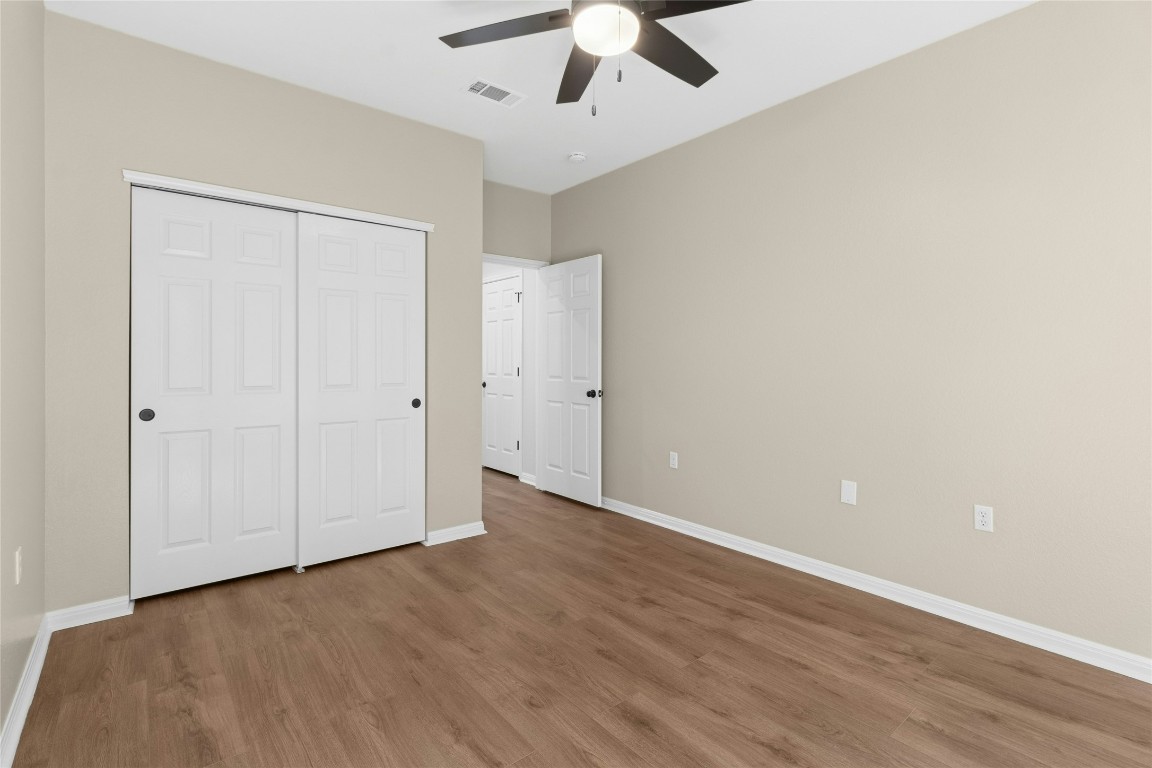 110 Crosby Street Georgetown, TX 78633 - Photo 20 of 40 a view of an empty room with wooden floor