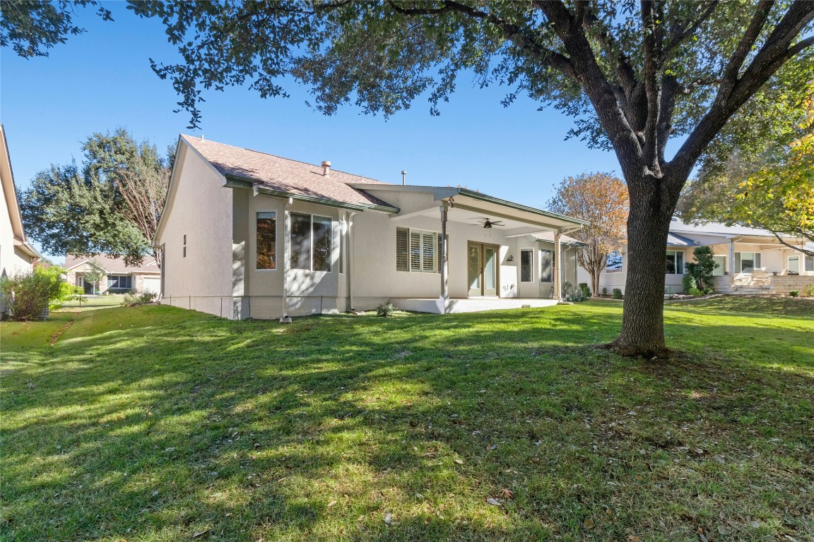 110 Crosby Street Georgetown, TX 78633 - Photo 27 of 40 a view of a house with a big yard and large trees
