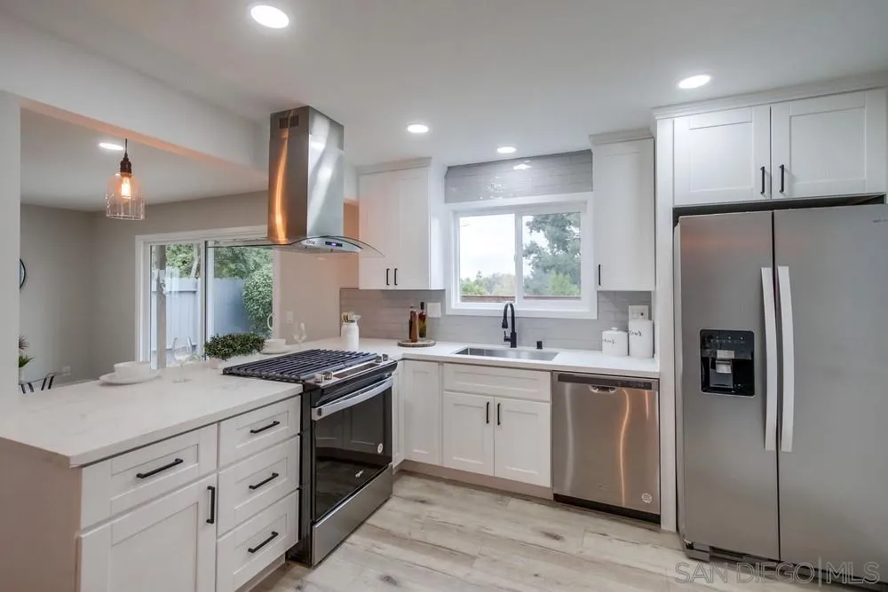 5886 Cowles Mountain Boulevard La Mesa, CA 91942 - Photo 11 of 39 a kitchen with a sink stove and refrigerator