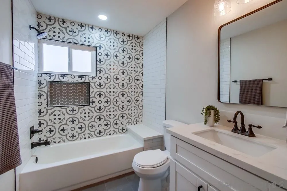 5886 Cowles Mountain Boulevard La Mesa, CA 91942 - Photo 14 of 39 a bathroom with a sink toilet and shower