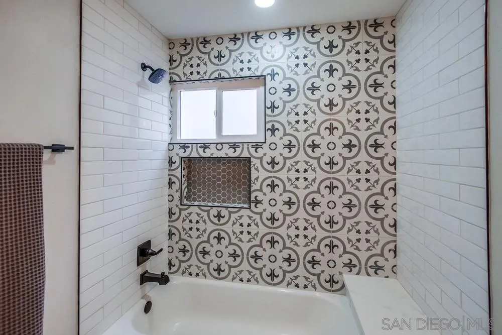 5886 Cowles Mountain Boulevard La Mesa, CA 91942 - Photo 15 of 39 a bathroom with a bathtub and a shower