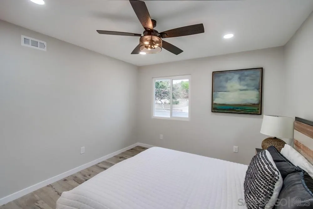 5886 Cowles Mountain Boulevard La Mesa, CA 91942 - Photo 17 of 39 a bedroom with a bed and a window