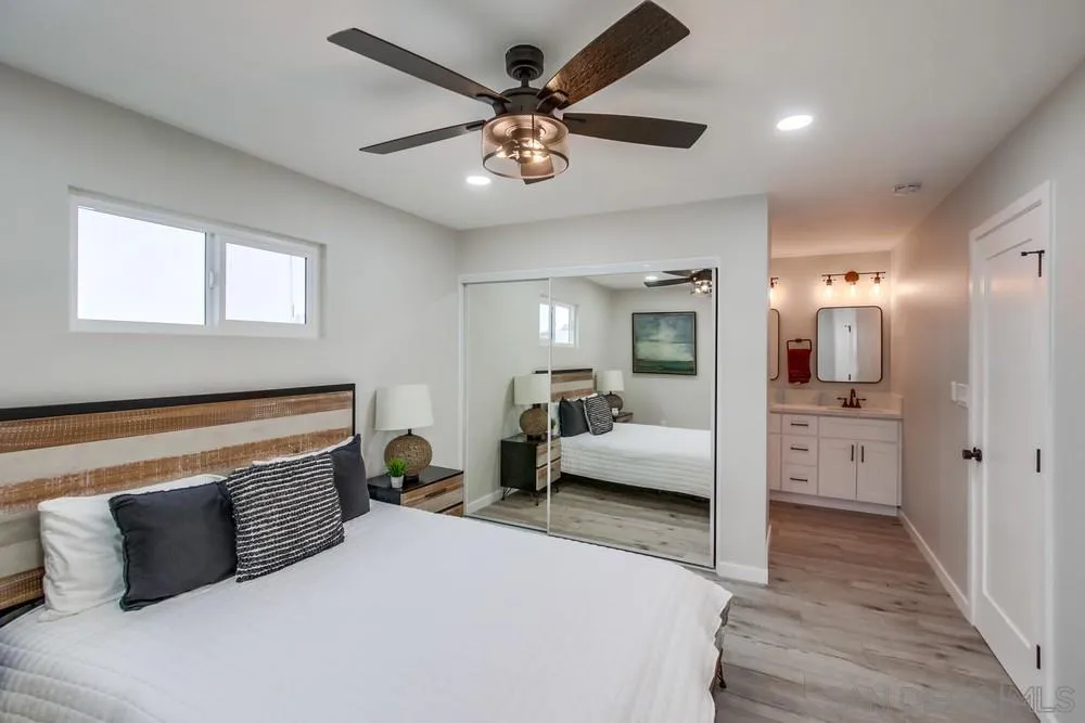 5886 Cowles Mountain Boulevard La Mesa, CA 91942 - Photo 18 of 39 a living room with furniture and a chandelier