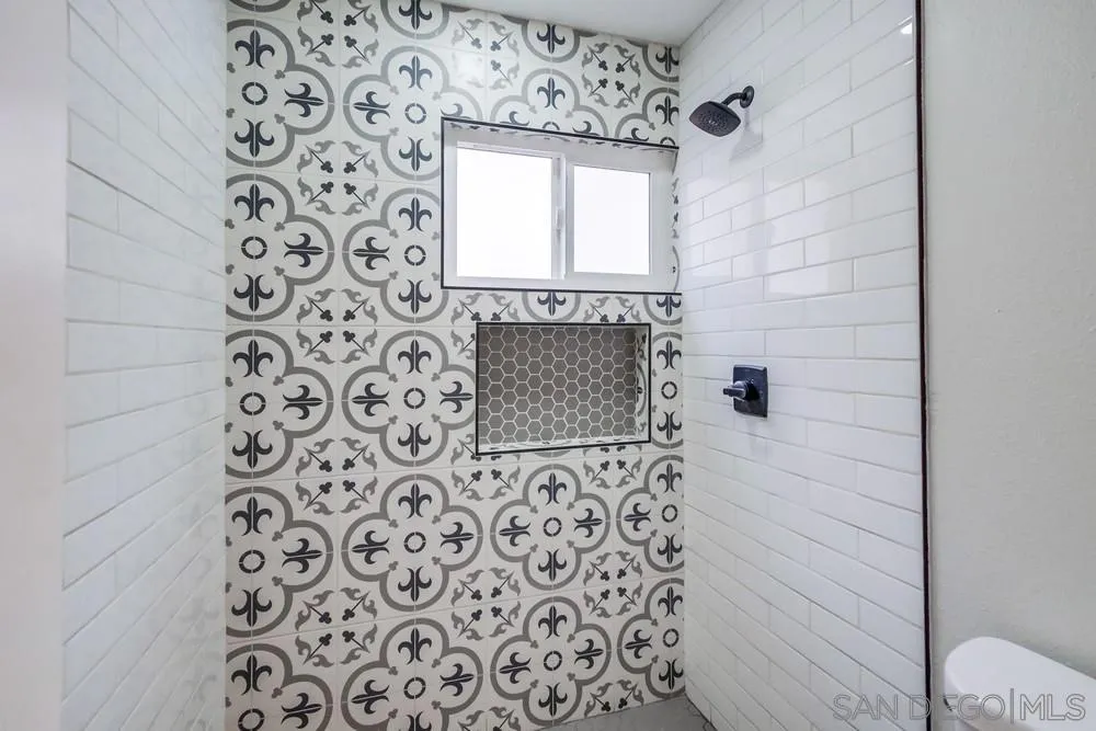5886 Cowles Mountain Boulevard La Mesa, CA 91942 - Photo 20 of 39 a bathroom with a sink and a mirror