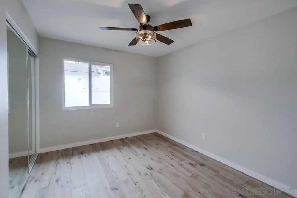 5886 Cowles Mountain Boulevard La Mesa, CA 91942 - Photo 21 of 39 wooden floor in an empty room with a window