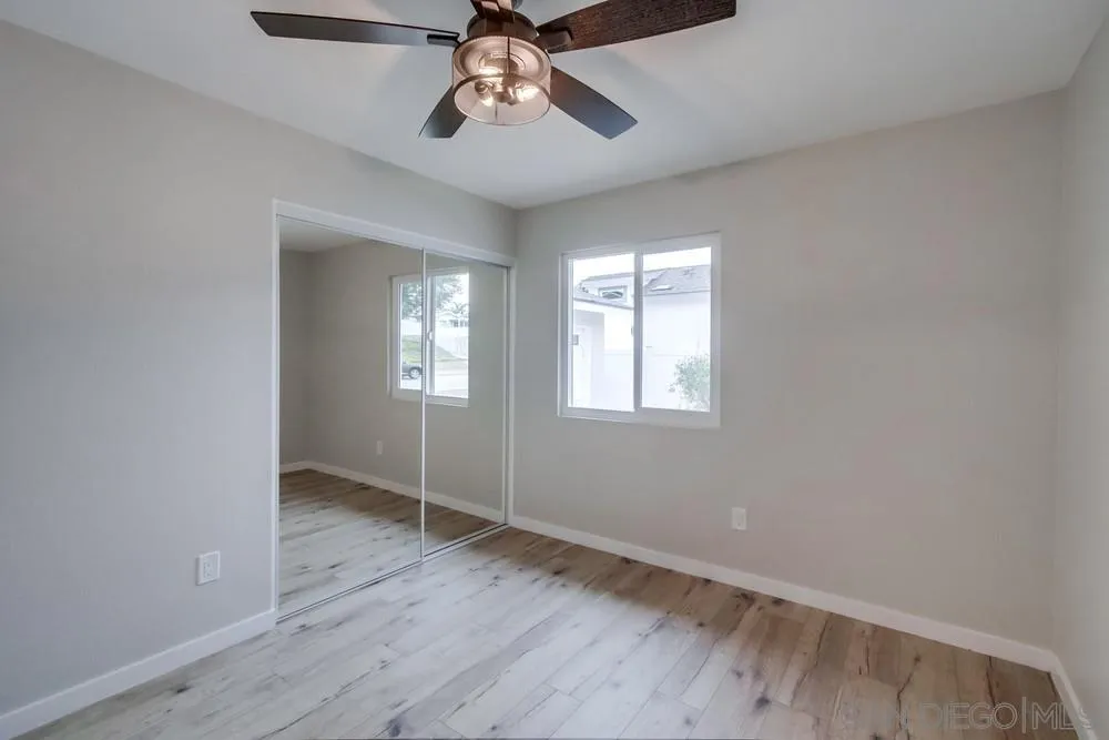 5886 Cowles Mountain Boulevard La Mesa, CA 91942 - Photo 22 of 39 wooden floor in an empty room with a window