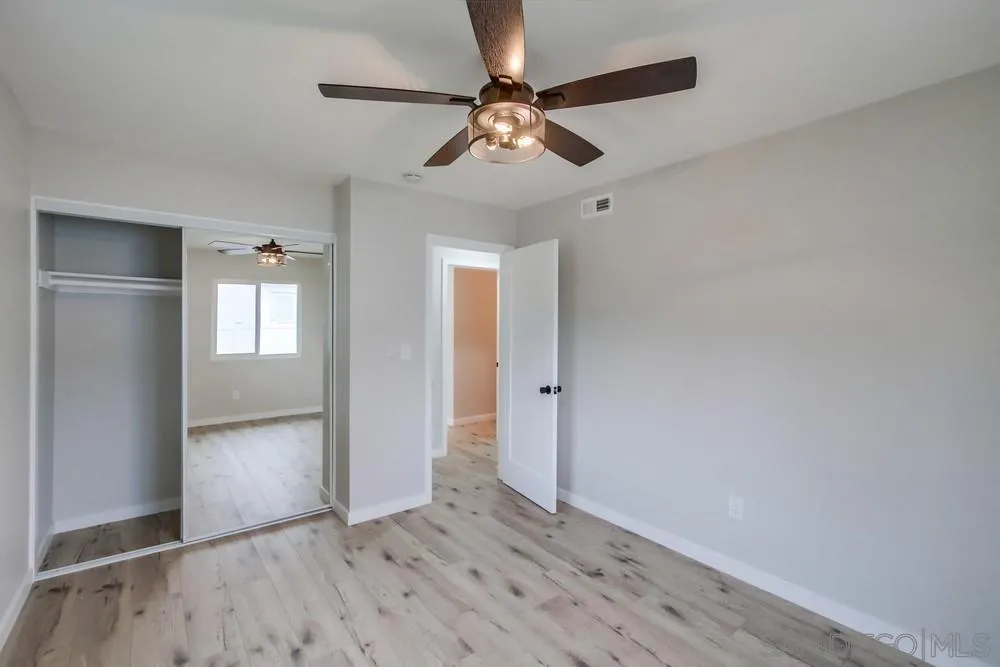 5886 Cowles Mountain Boulevard La Mesa, CA 91942 - Photo 25 of 39 wooden floor in an empty room with a window