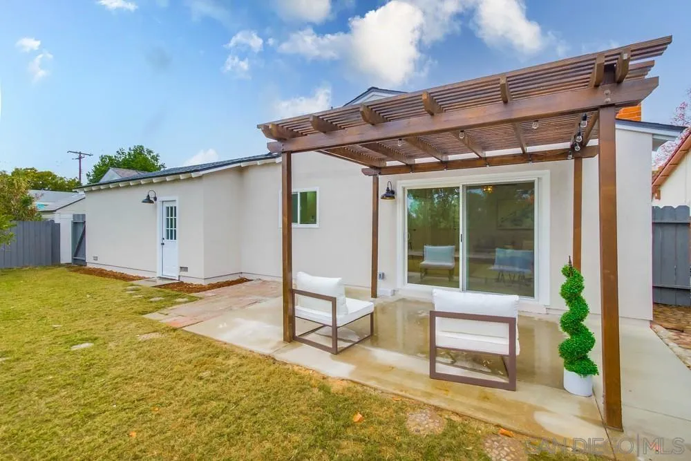 5886 Cowles Mountain Boulevard La Mesa, CA 91942 - Photo 35 of 39 a patio with table and chairs and potted plants