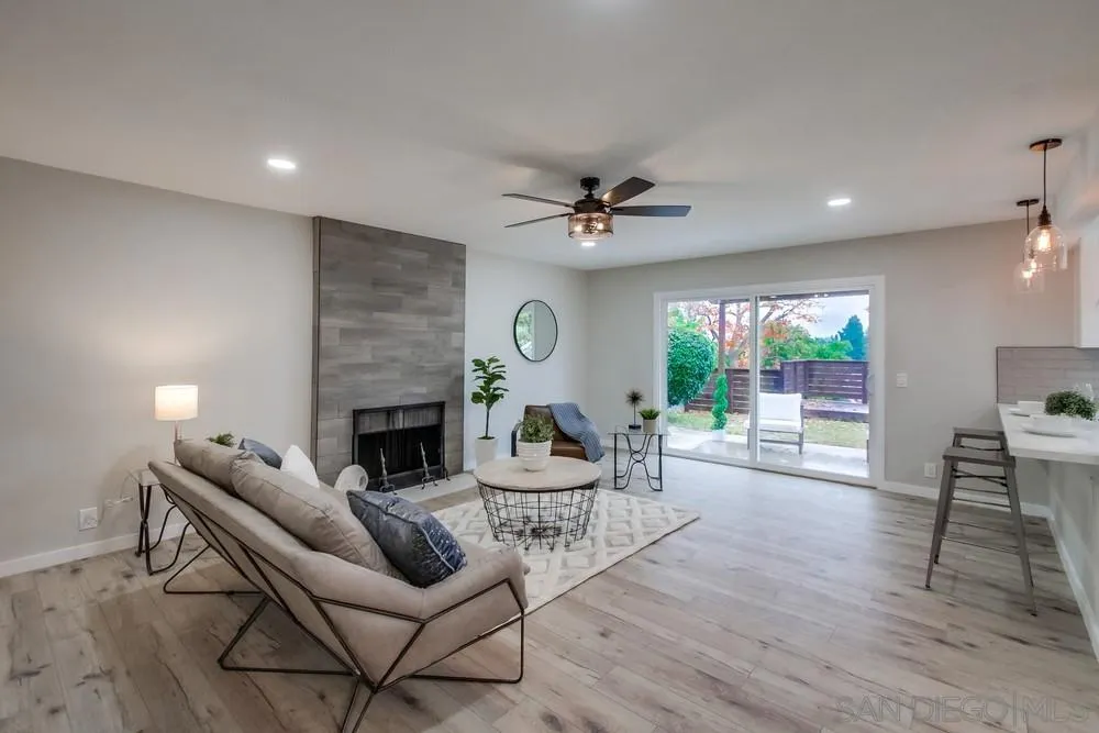 5886 Cowles Mountain Boulevard La Mesa, CA 91942 - Photo 4 of 39 a living room with furniture and a fireplace