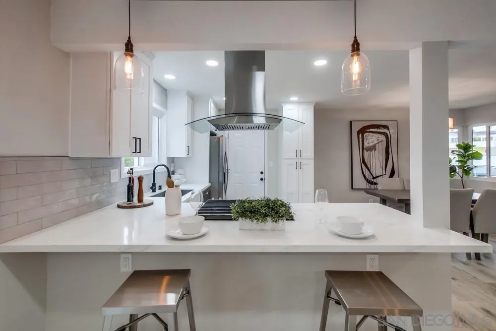 5886 Cowles Mountain Boulevard La Mesa, CA 91942 - Photo 8 of 39 a view of kitchen with sink refrigerator and microwave