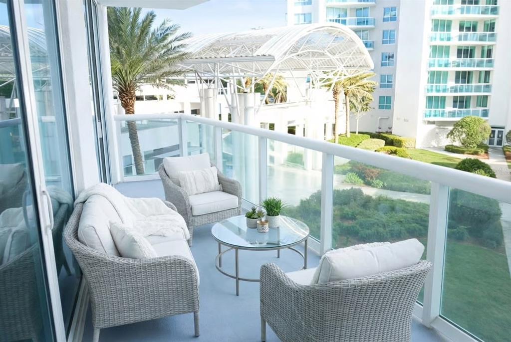 231 Riverside Drive, Unit 3081 Daytona Beach, FL 32117 - Photo 3 of 15 a living room with furniture and a large window