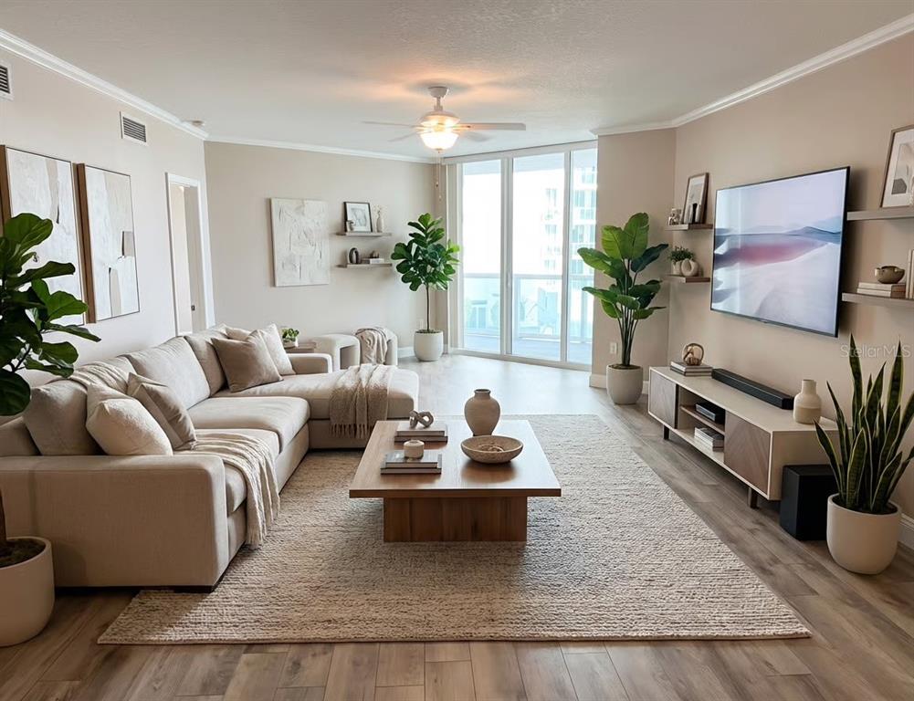 231 Riverside Drive, Unit 3081 Daytona Beach, FL 32117 - Photo 4 of 15 a living room with furniture potted plant and a window