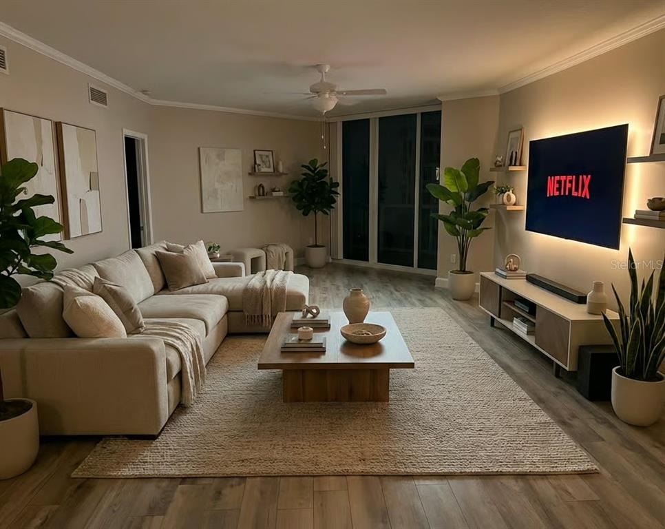 231 Riverside Drive, Unit 3081 Daytona Beach, FL 32117 - Photo 5 of 15 a living room with furniture potted plant and a window