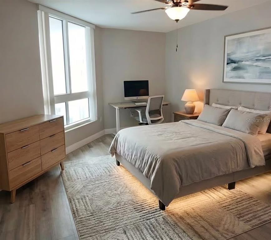 231 Riverside Drive, Unit 3081 Daytona Beach, FL 32117 - Photo 10 of 15 a spacious bedroom with a bed and a flat screen tv