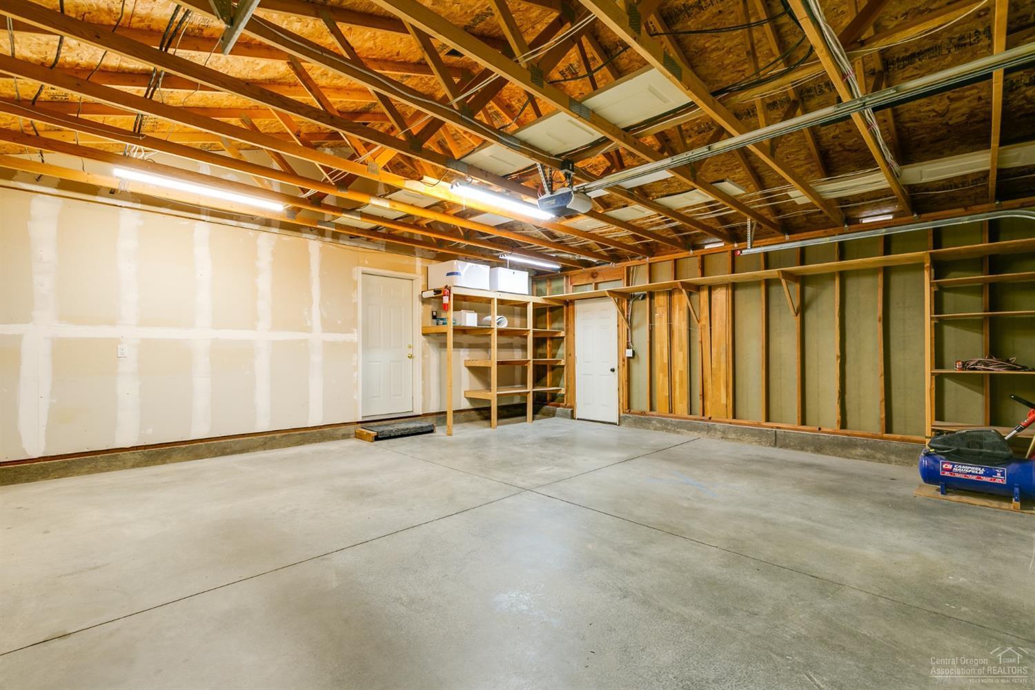 19026 Choctaw Road Bend, OR 97702 - Photo 14 of 23 Over sized 2 car garage offers abundance