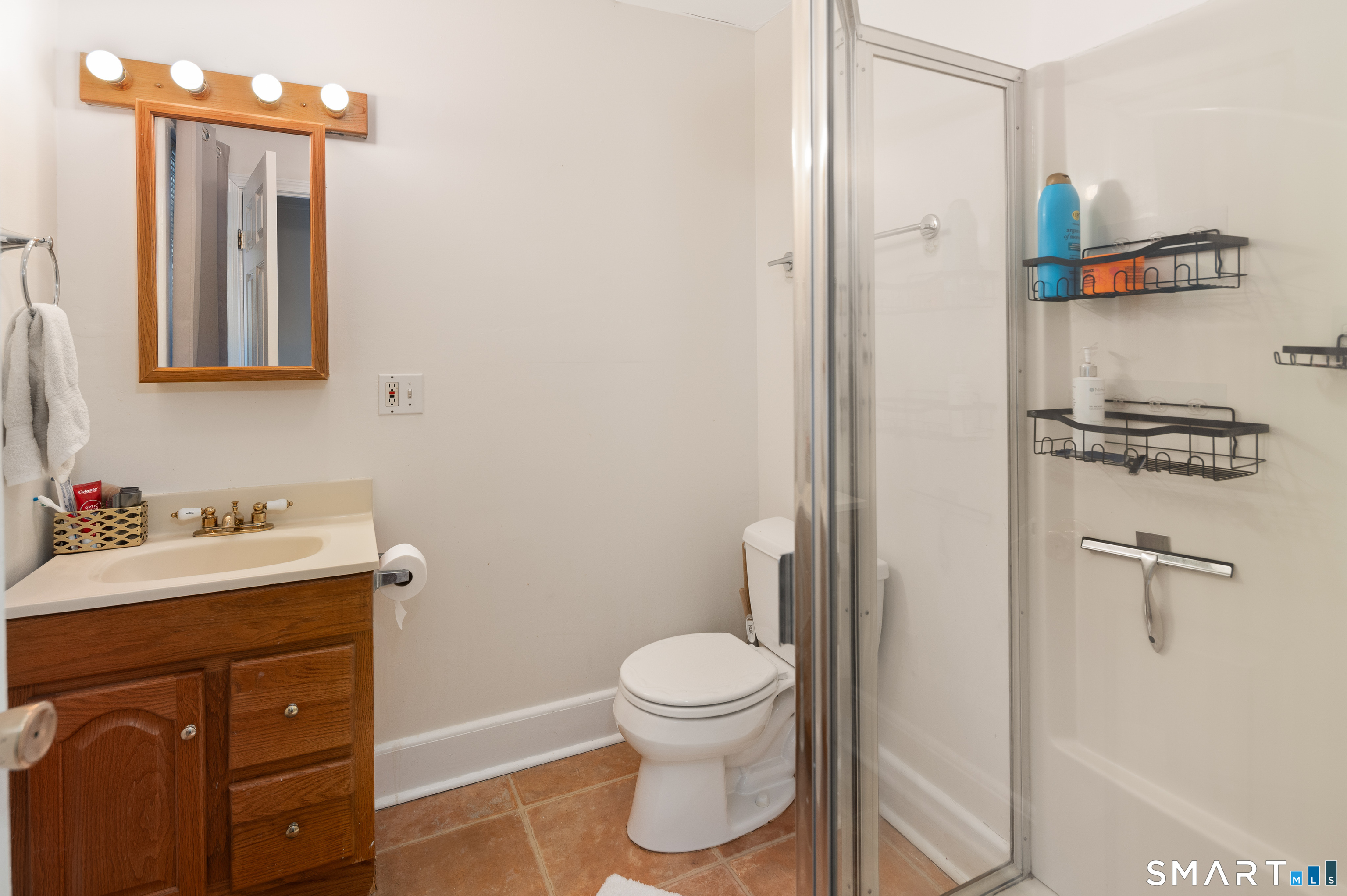 760 Hope Street Stamford, CT 06907 - Photo 13 of 38 a bathroom with a toilet sink and mirror