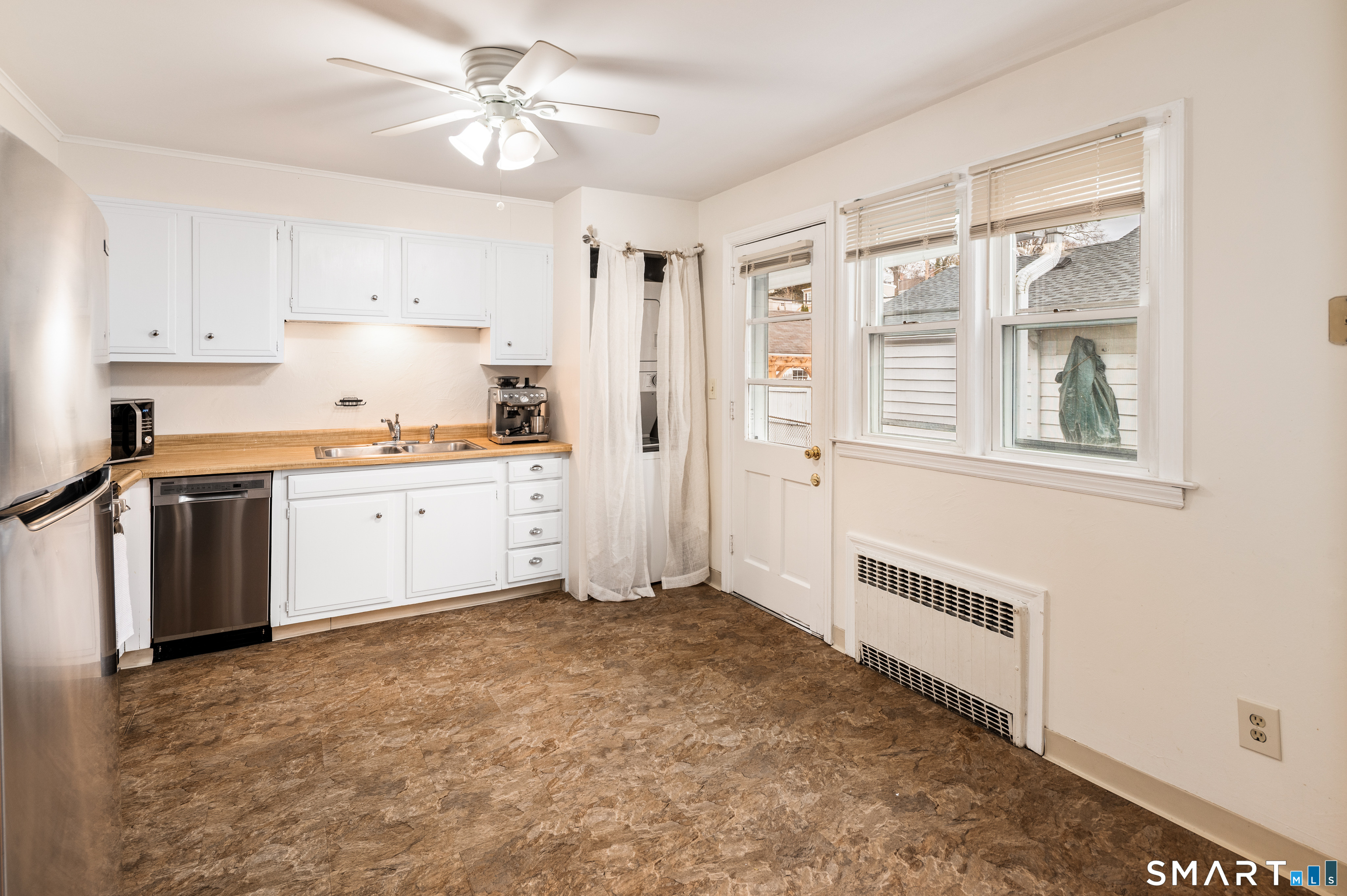 760 Hope Street Stamford, CT 06907 - Photo 14 of 38 a view of a kitchen with a sink cabinets and wooden floor