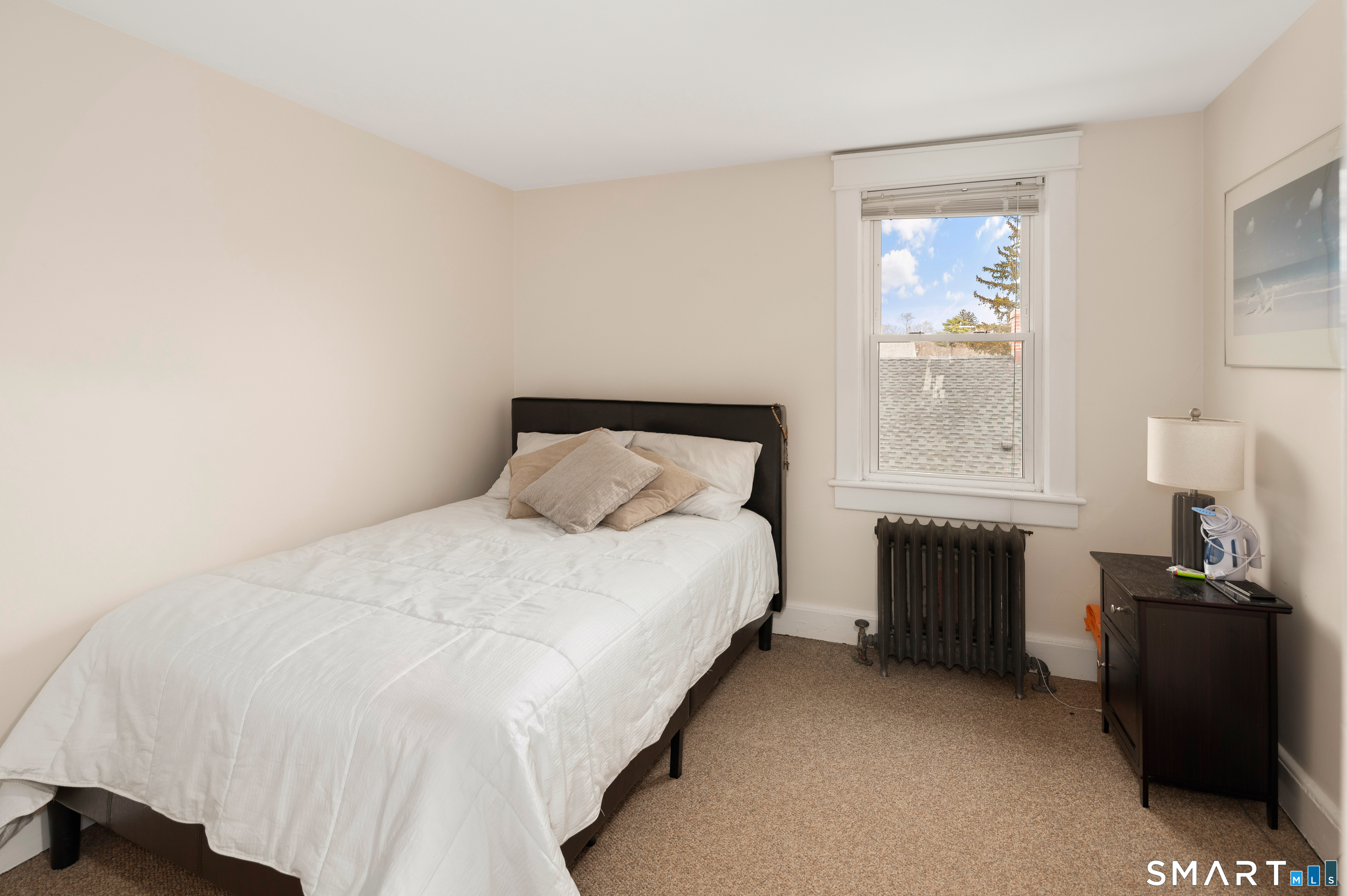 760 Hope Street Stamford, CT 06907 - Photo 20 of 38 a bedroom with a bed and a window