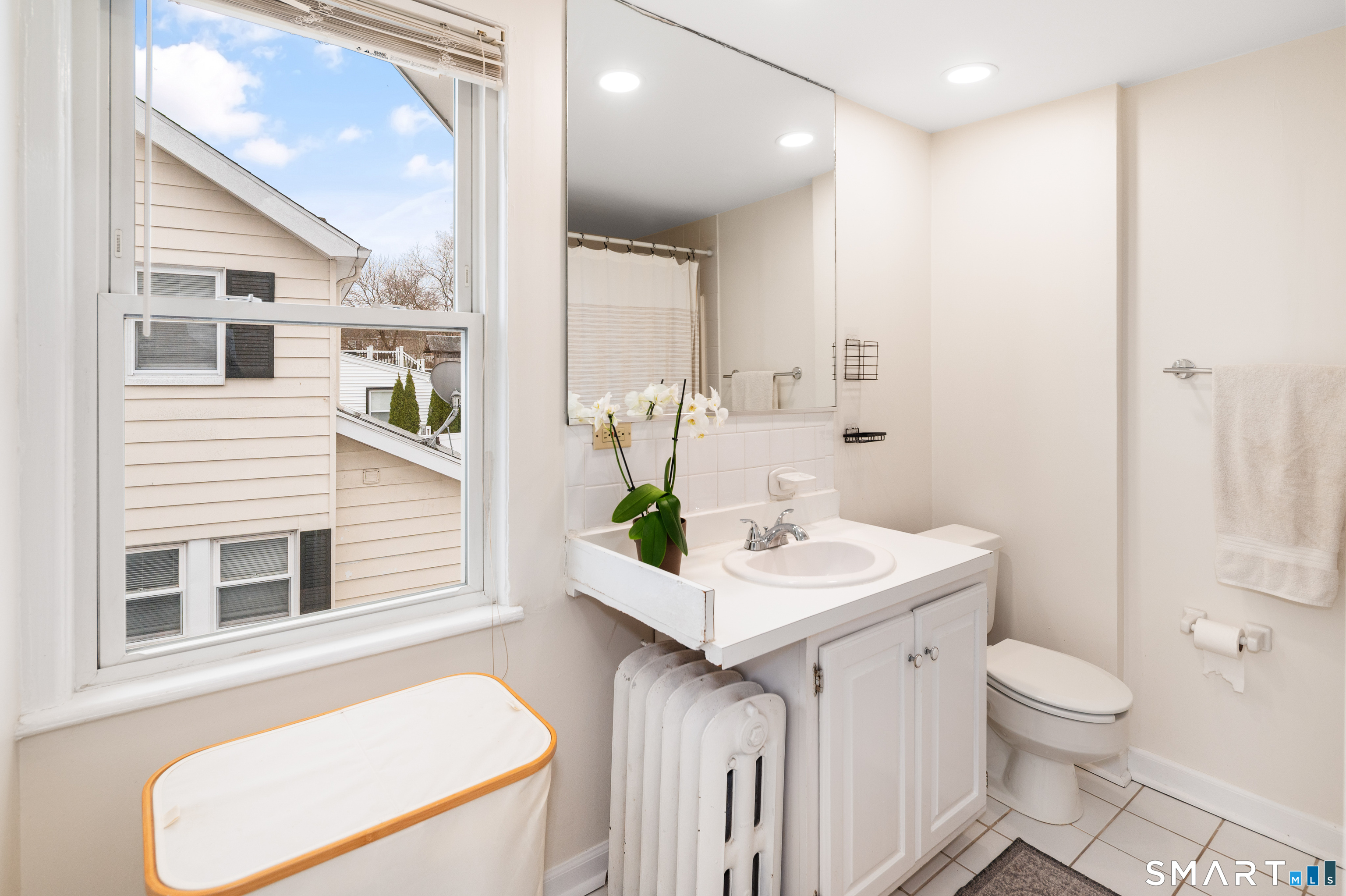 760 Hope Street Stamford, CT 06907 - Photo 21 of 38 a bathroom with a sink toilet and mirror