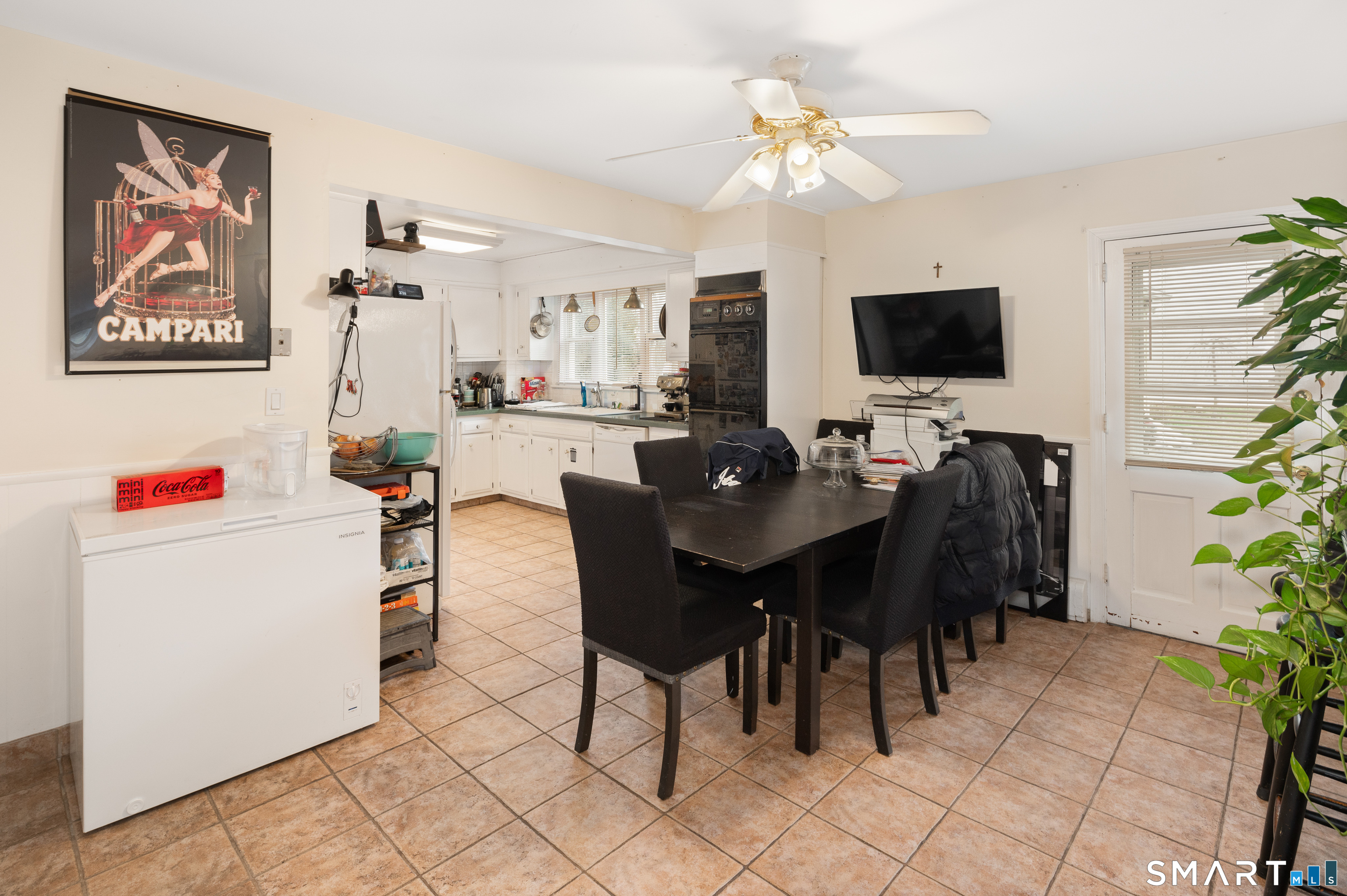 760 Hope Street Stamford, CT 06907 - Photo 23 of 38 a view of a workspace with furniture and a flat screen tv