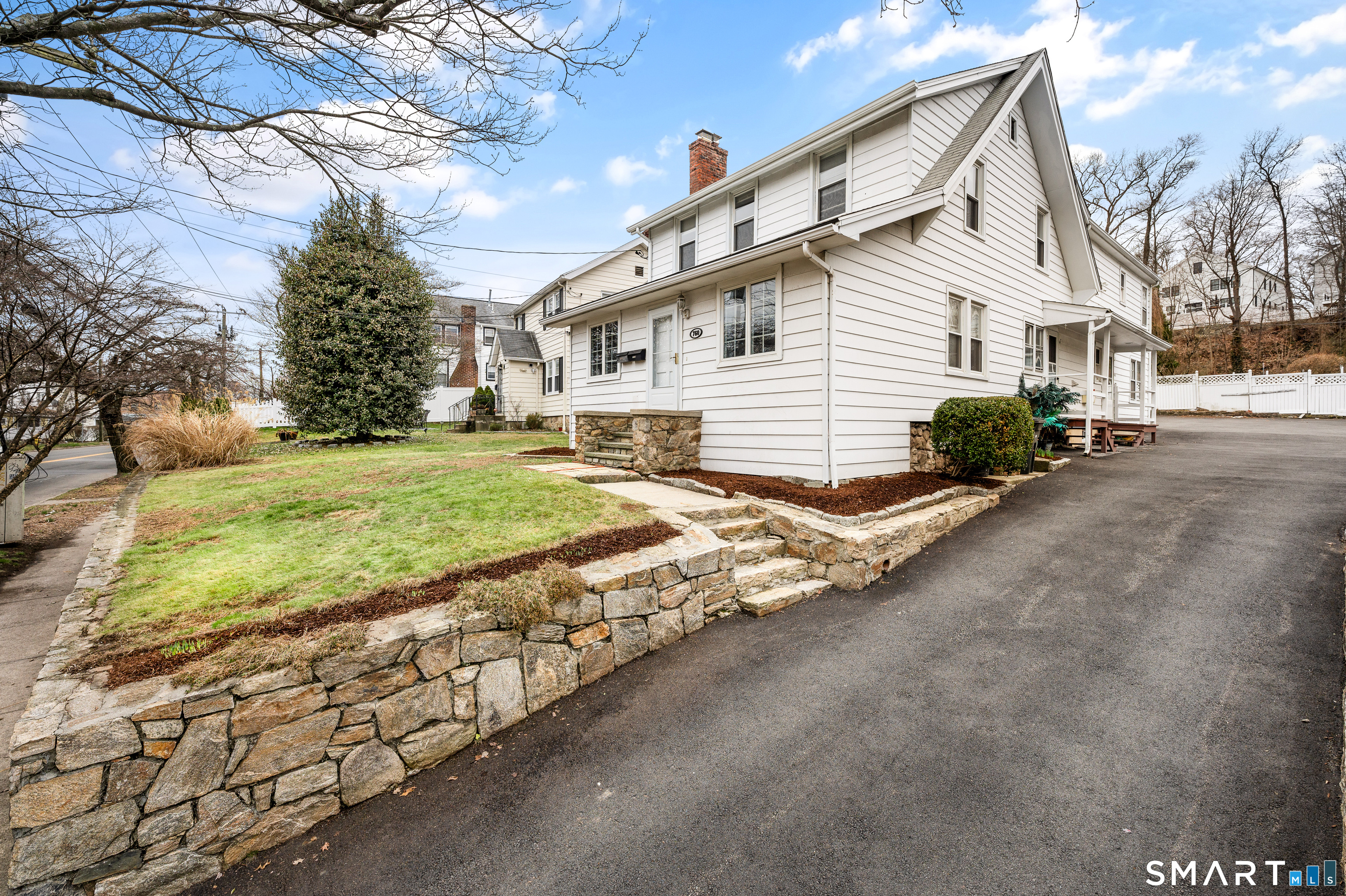 760 Hope Street Stamford, CT 06907 - Photo 3 of 38 a view of a house with a yard