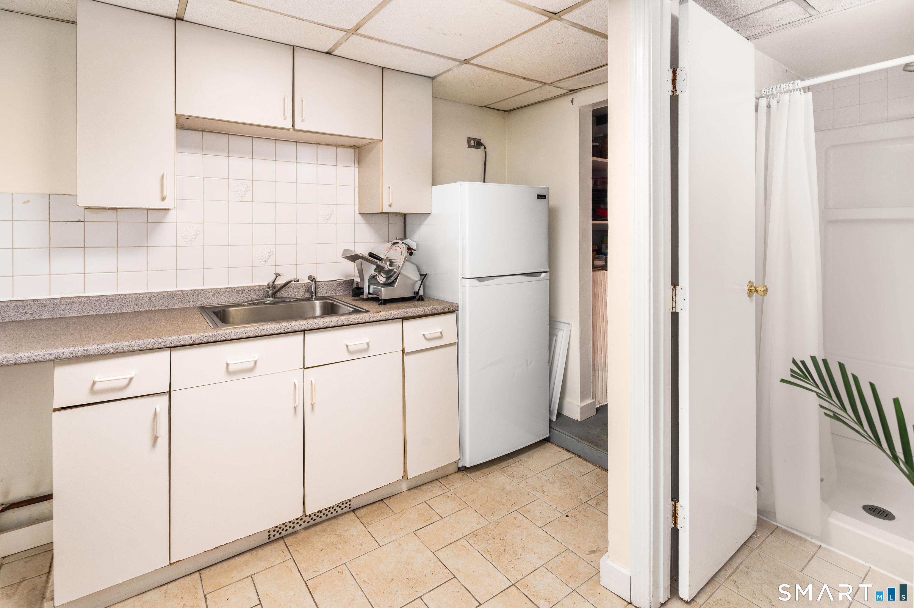 760 Hope Street Stamford, CT 06907 - Photo 31 of 38 a kitchen with a refrigerator and a sink