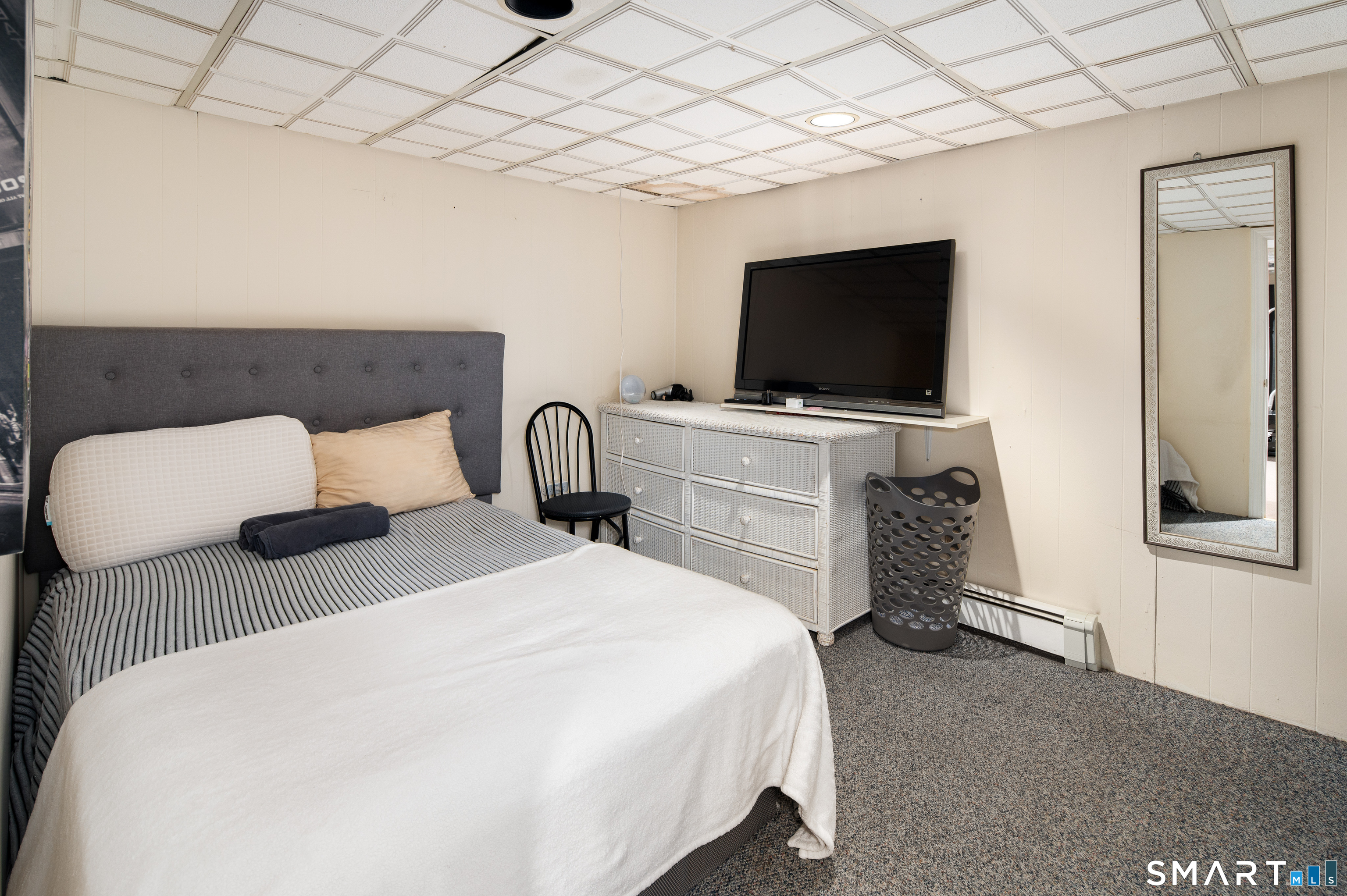 760 Hope Street Stamford, CT 06907 - Photo 34 of 38 a bedroom with a bed and a flat screen tv