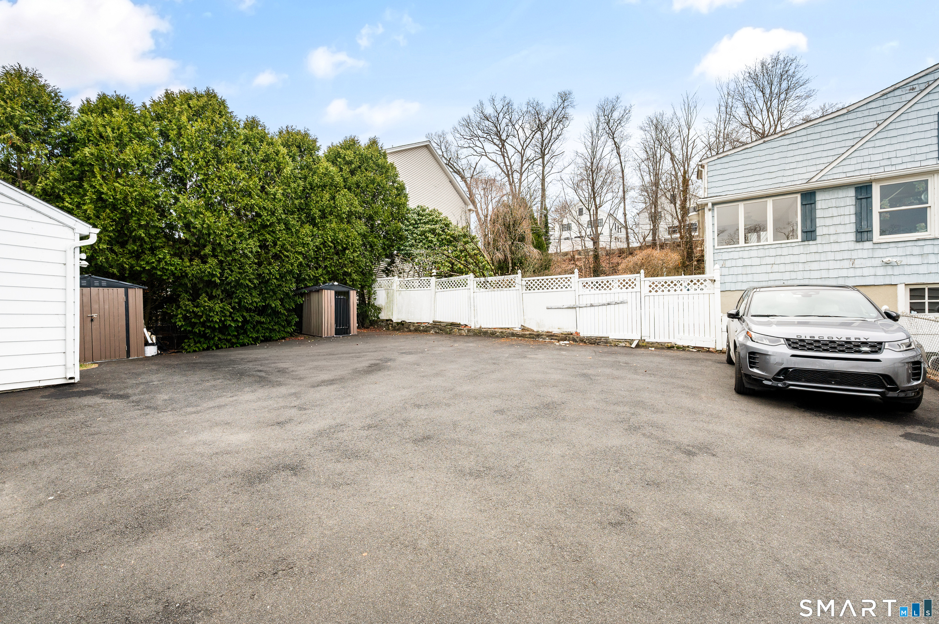 760 Hope Street Stamford, CT 06907 - Photo 5 of 38 a view of a car parked in front of a house