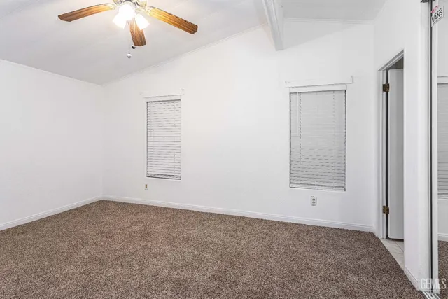 an empty room with a empty space and a window