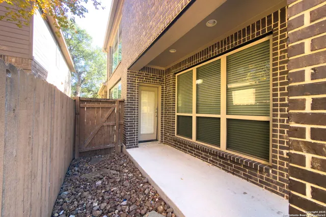 a view of a house with a door and wooden floor