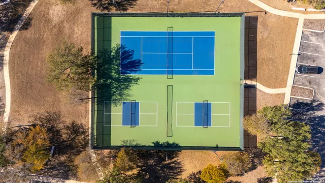 a sign that is on the side of a tree