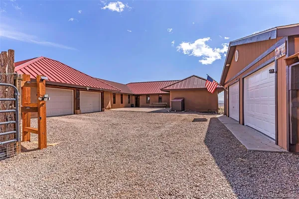 a front view of a house with a yard and a garage