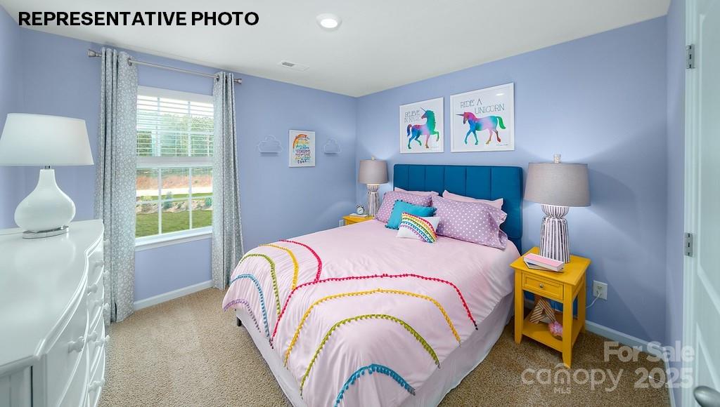 834 North Naughton Street Chester, SC 29706 - Photo 16 of 28 a bedroom with a bed and a lamp