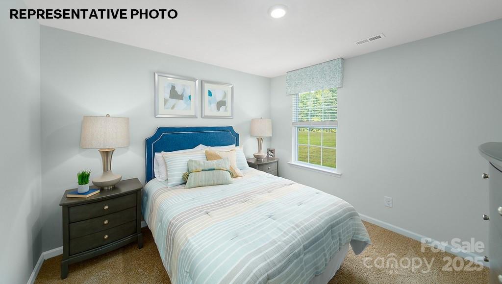 834 North Naughton Street Chester, SC 29706 - Photo 20 of 28 a bedroom with a bed and a lamp on dresser