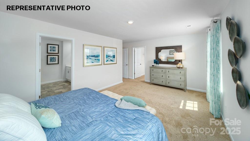 834 North Naughton Street Chester, SC 29706 - Photo 25 of 28 a bedroom with a bed and a flat screen tv