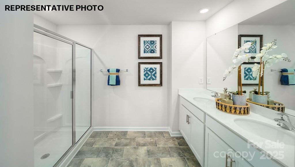 834 North Naughton Street Chester, SC 29706 - Photo 26 of 28 a spacious bathroom with a double vanity sink a mirror and a shower