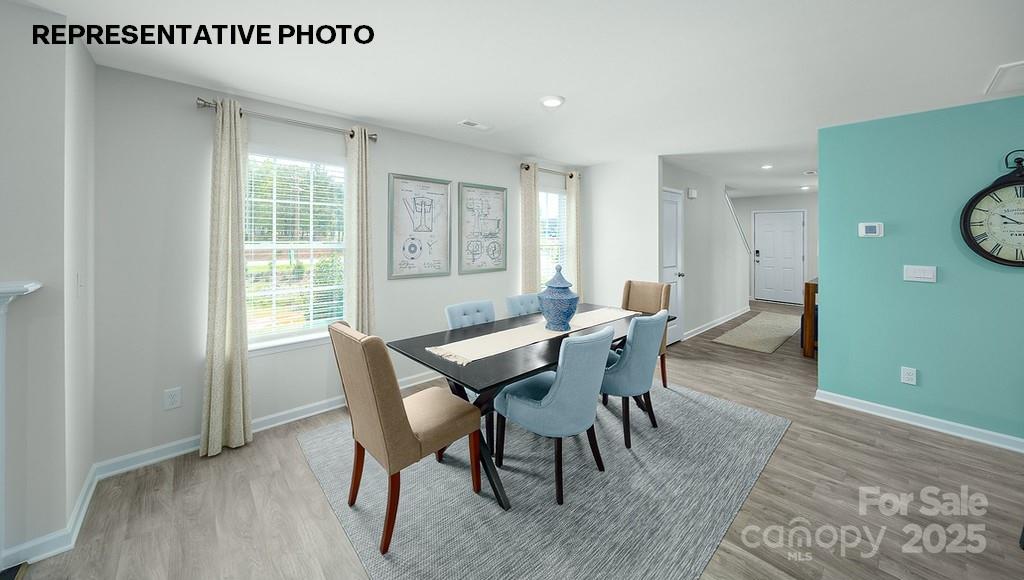 834 North Naughton Street Chester, SC 29706 - Photo 3 of 28 a view of a dining room with furniture window and wooden floor