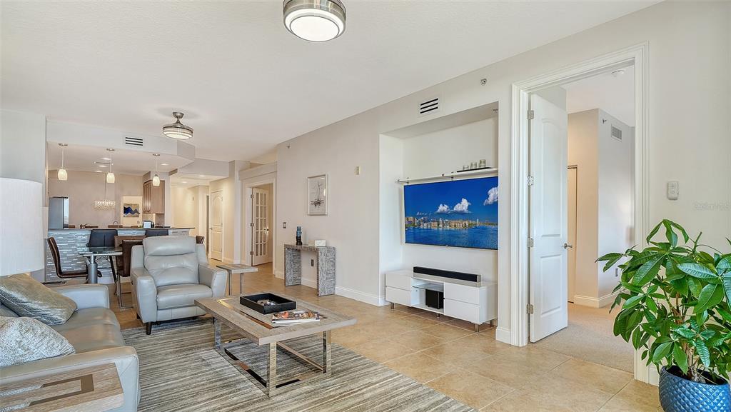 610 Riviera Dunes Way, Unit 306 Palmetto, FL 34221 - Photo 21 of 58 a living room with furniture and a potted plant