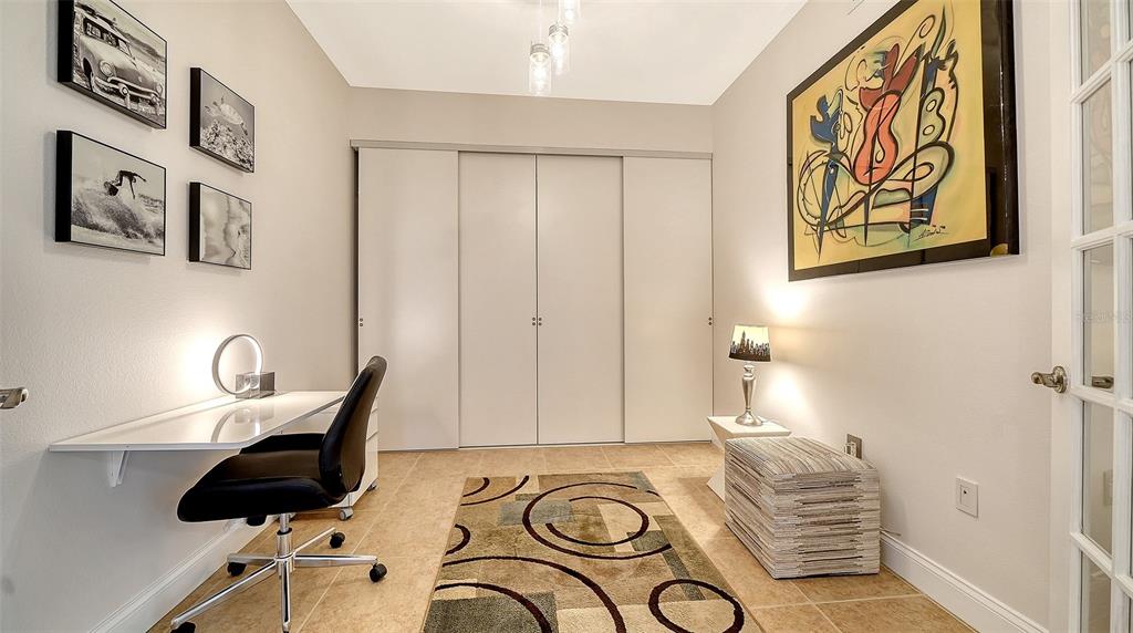 610 Riviera Dunes Way, Unit 306 Palmetto, FL 34221 - Photo 23 of 58 a view of a chair and table in a livingroom