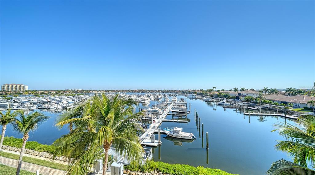 610 Riviera Dunes Way, Unit 306 Palmetto, FL 34221 - Photo 25 of 58 a view of a lake with a city