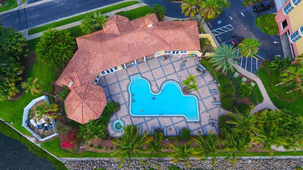 610 Riviera Dunes Way, Unit 306 Palmetto, FL 34221 - Photo 44 of 58 a sign that is on the side of the tree