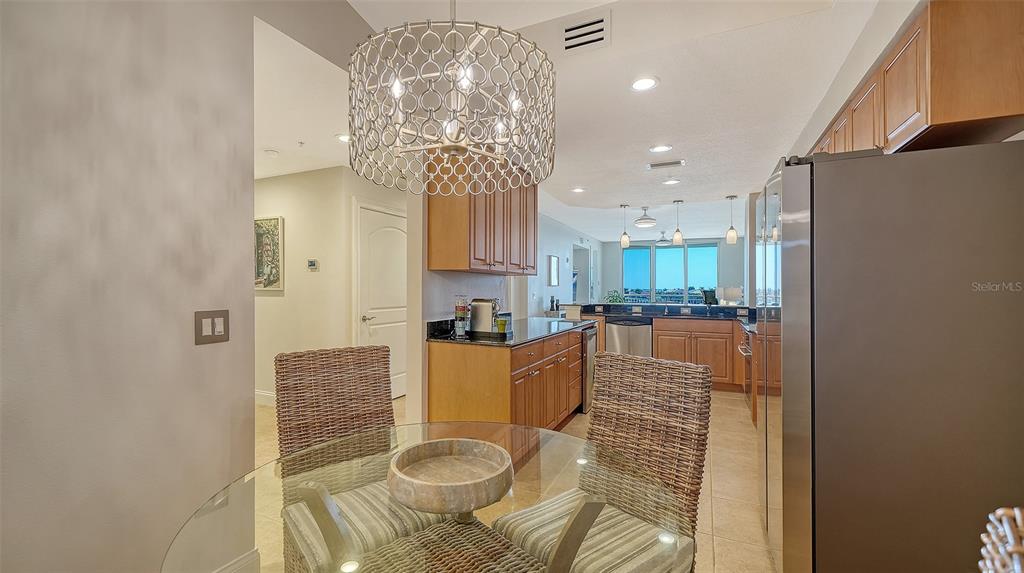 610 Riviera Dunes Way, Unit 306 Palmetto, FL 34221 - Photo 7 of 58 a very nice looking dining room with furniture