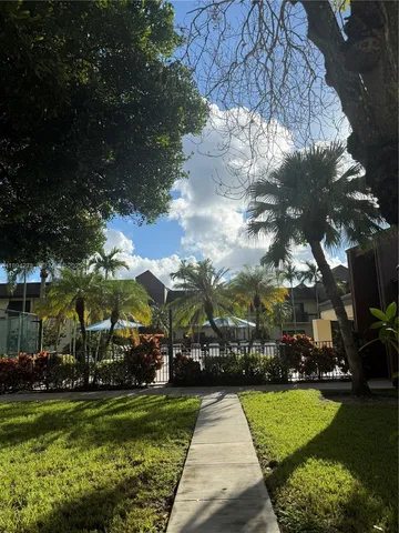 a view of a park with large trees