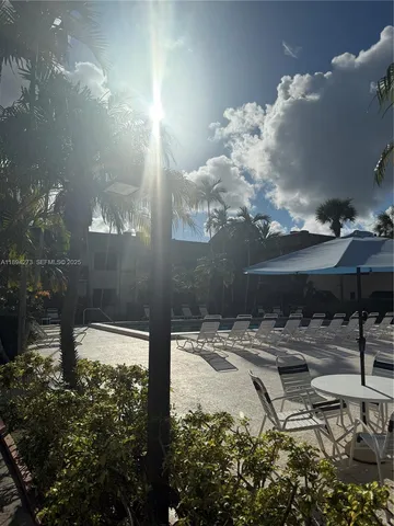 a view of a backyard of the house