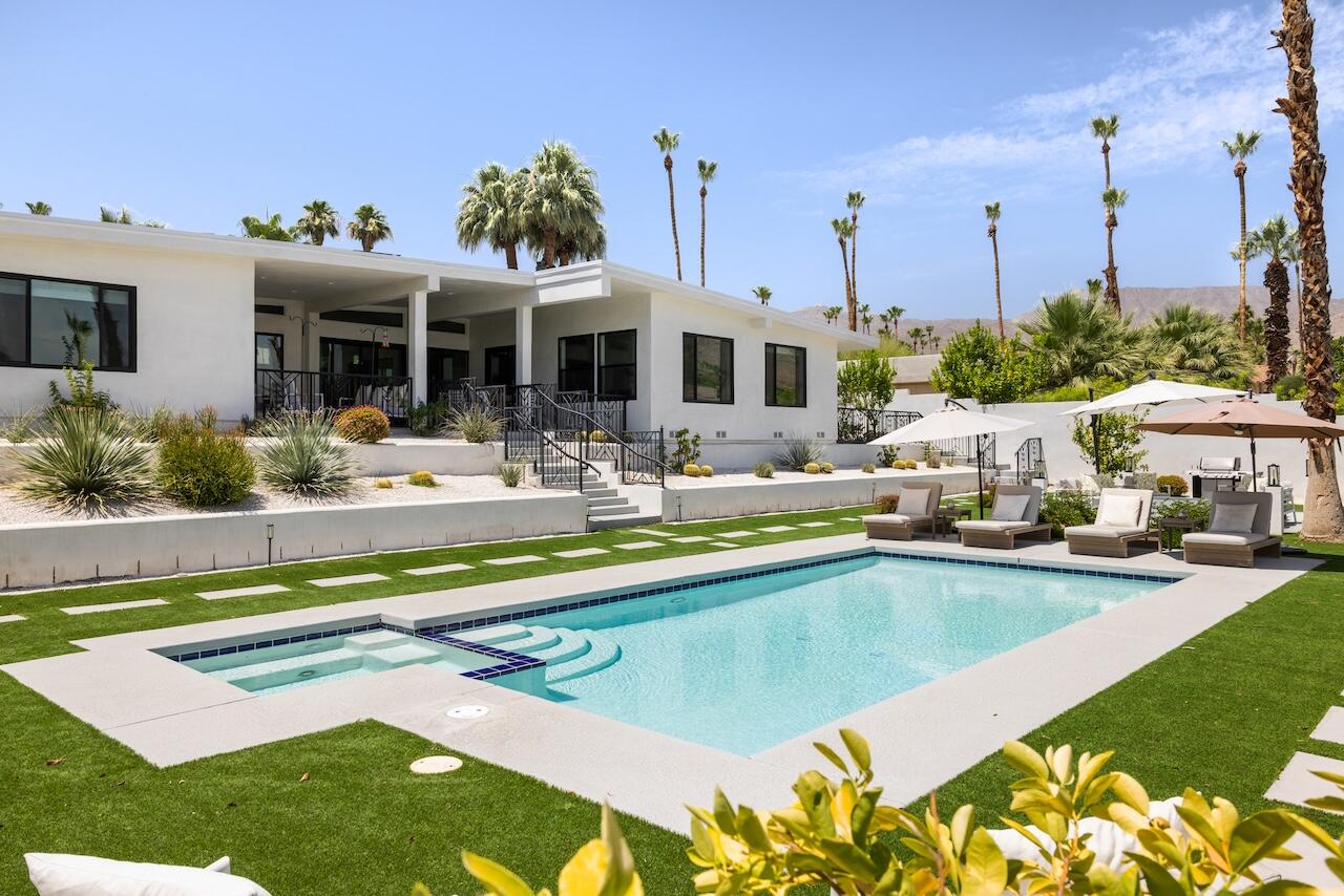 72870 Bel Air Road, Unit 4 Palm Desert, CA 92260 - Photo 18 of 36 a view of a patio with swimming pool table and chairs