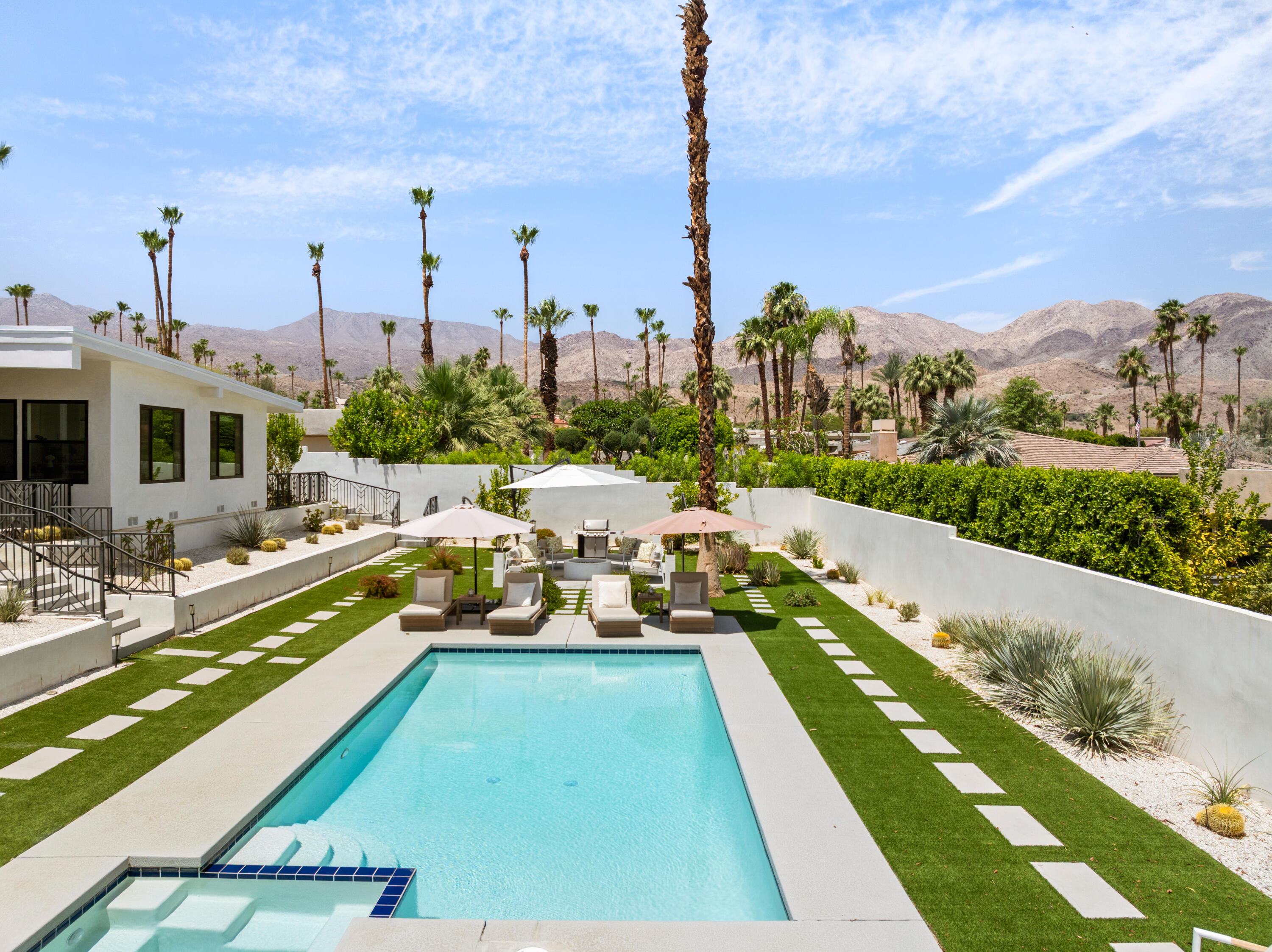 72870 Bel Air Road, Unit 4 Palm Desert, CA 92260 - Photo 21 of 36 a view of a city with lawn chairs