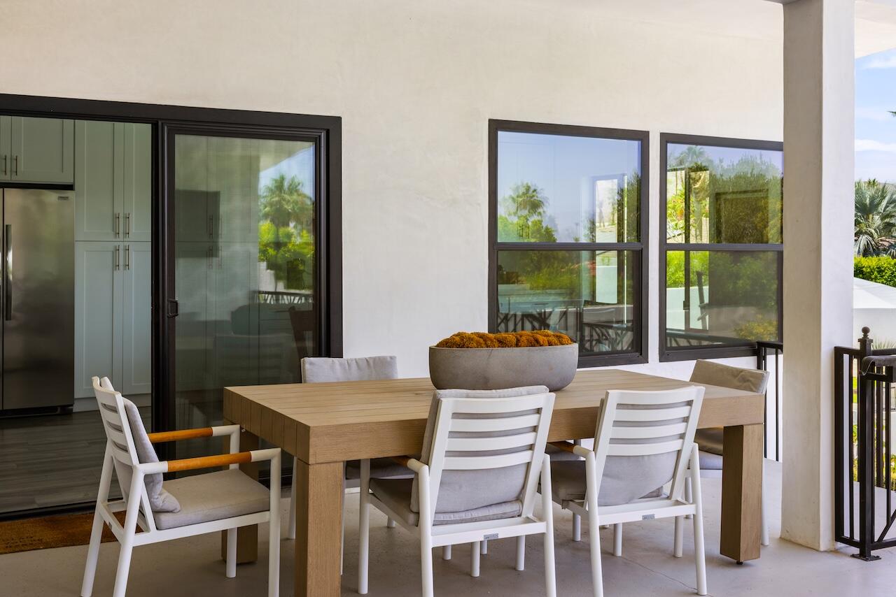 72870 Bel Air Road, Unit 4 Palm Desert, CA 92260 - Photo 23 of 36 a dining room with furniture and window